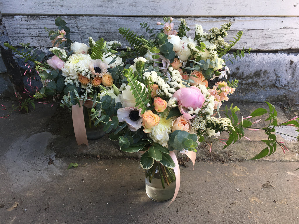 Bridesmaid bouquets in blush and whites by Gorgeous and Green for a local wedding.