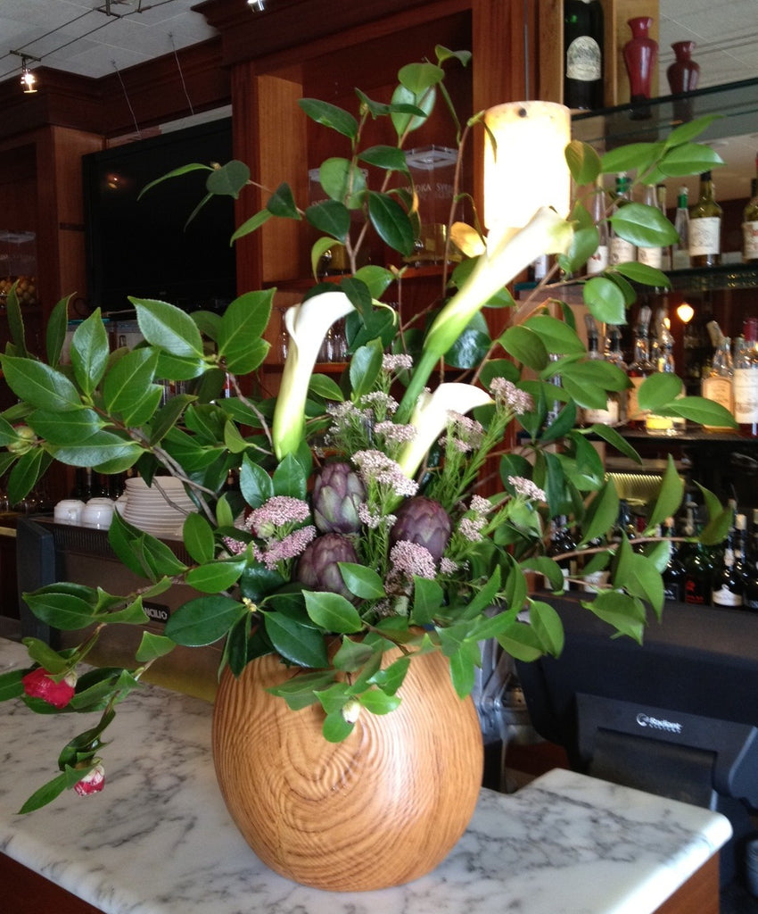 Calla and artichoke restaurant arrangement by Gorgeous and Green