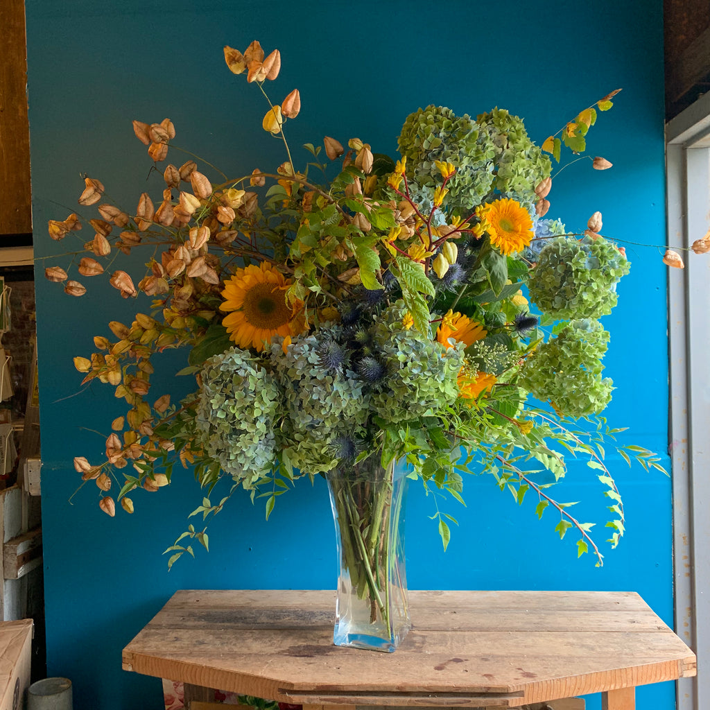 large impressive sympathy arrangement in blues and golds